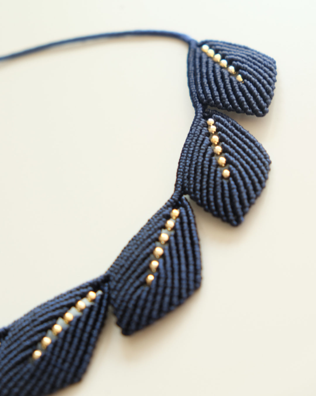 Handmade Aura navy blue artisan necklace crafted by Colombian artisans